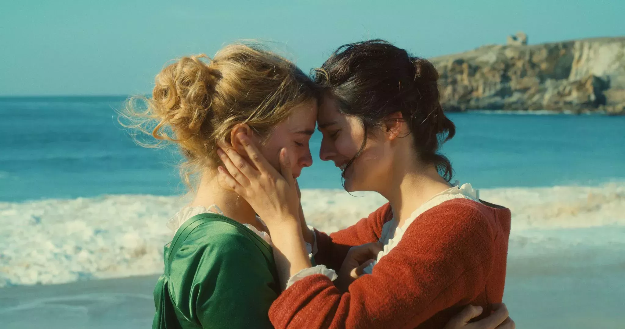 Portrait of a Lady on Fire - two ladies hugging and smiling by the ocean