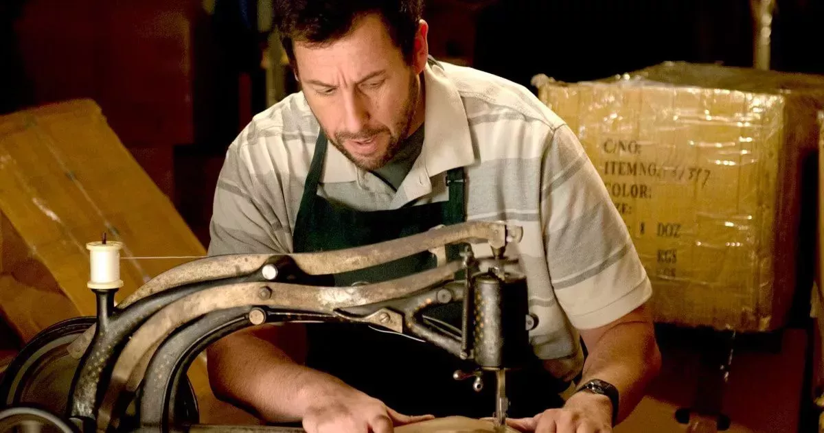 Adam Sandler at his sewing machine in The Cobbler