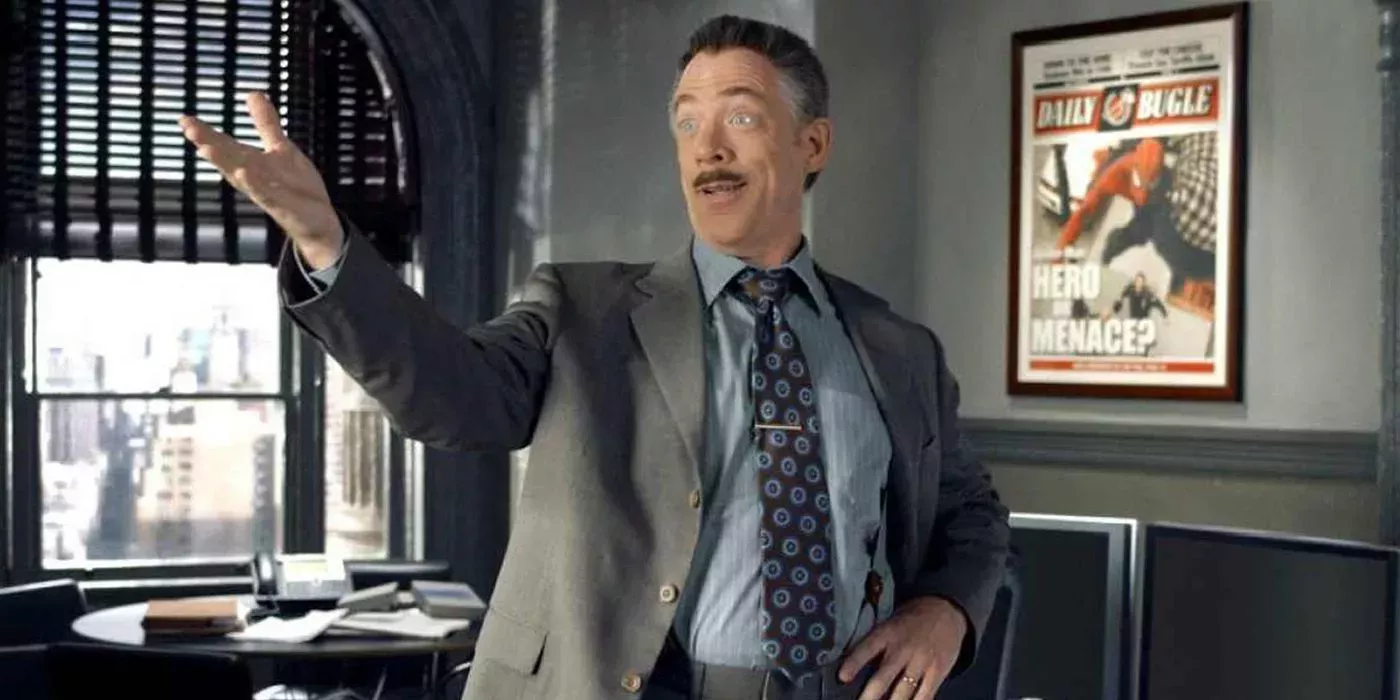 J Jonah Jameson with a Spider-Man newspaper in the background.