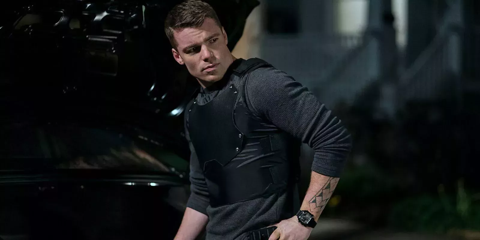 Peter Sutherland, played by Gabriel Basso, wearing bulletproof armor in The Night Agent