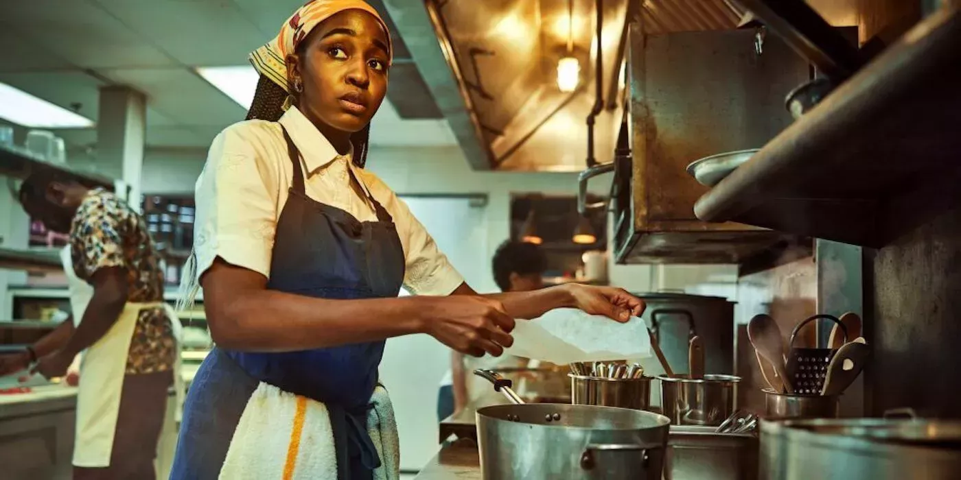 Sydney (Ayo Edebiri) works in a kitchen in The Bear