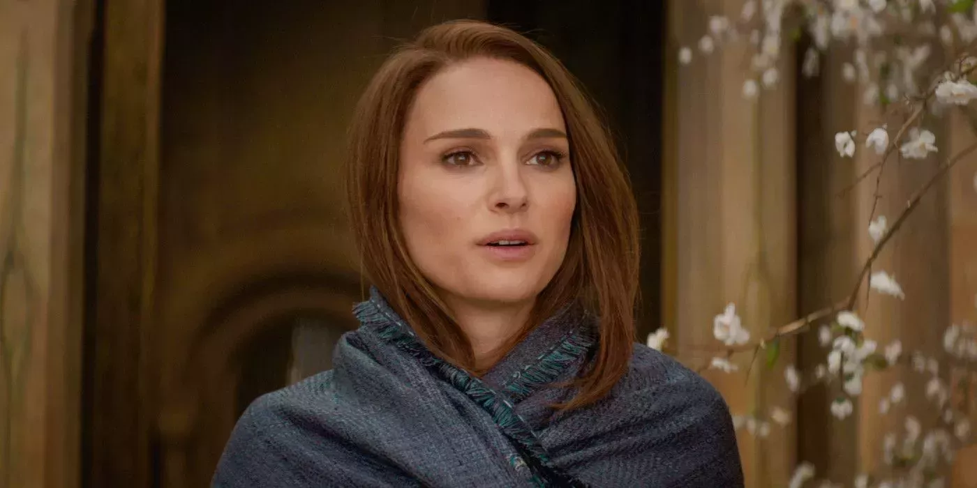 Natalie Portman smiling as Jane Foster in Thor: The Dark World.