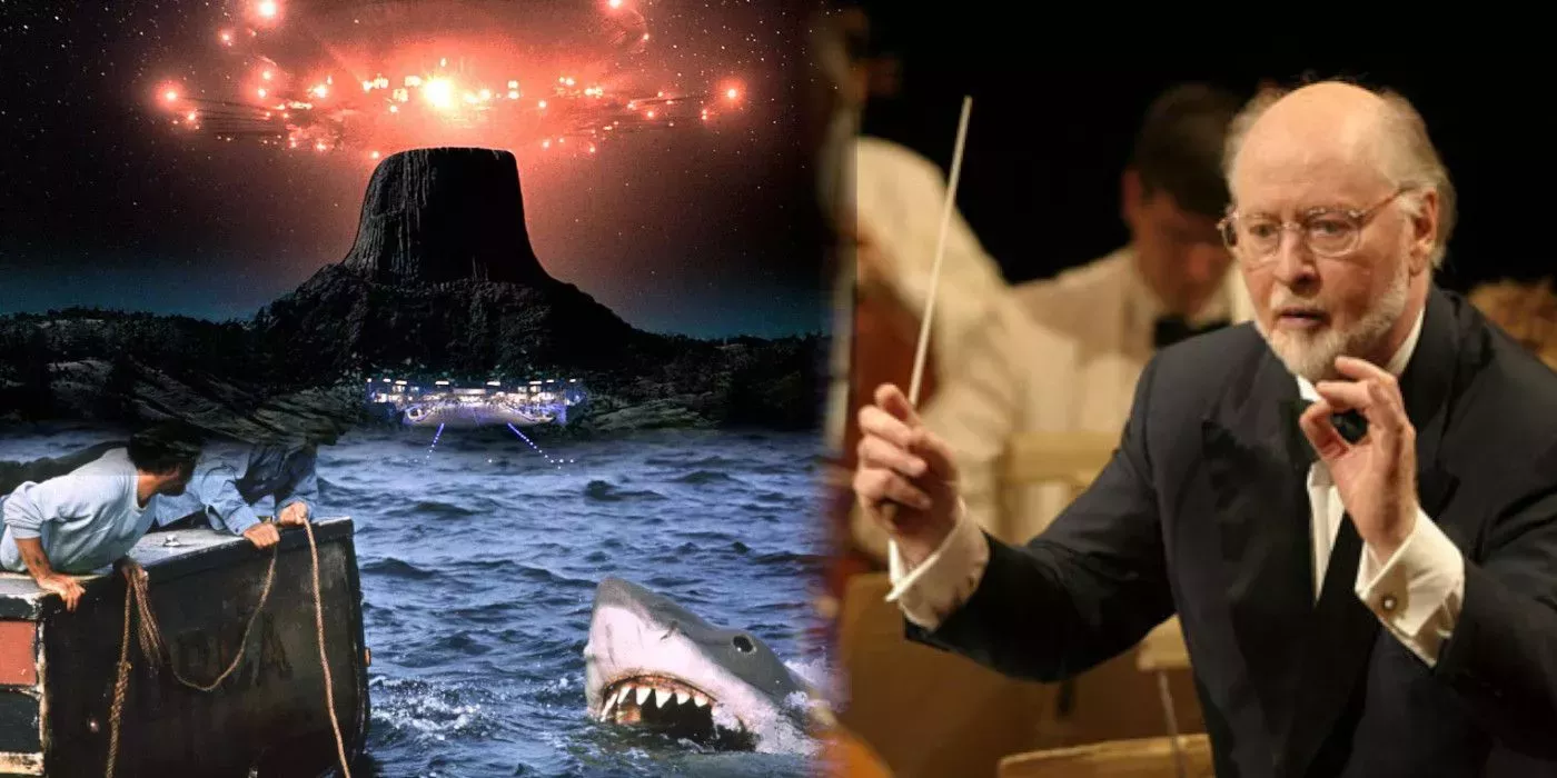 John Williams next to a shark and an alien ship.