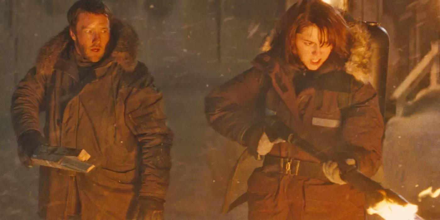 Kate and Sam burn the thing in The Thing (2011)