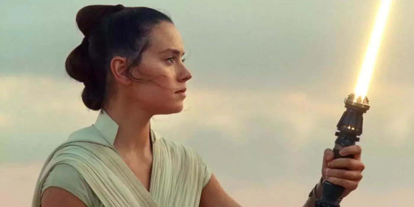 Rey activates her lightsaber in Star Wars The Rise of Skywalker