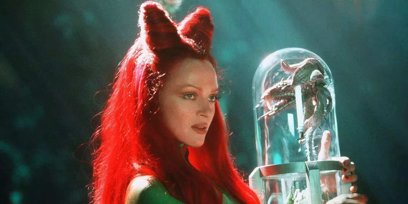 Poison Ivy holds one of her beloved plant creatures close in Batman & Robin (1997)