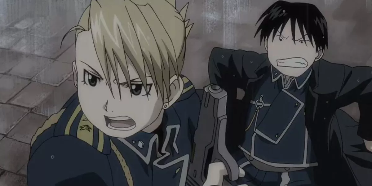 Riza Hawkeye protects Roy Mustang in Fullmetal Alchemist: Brotherhood.