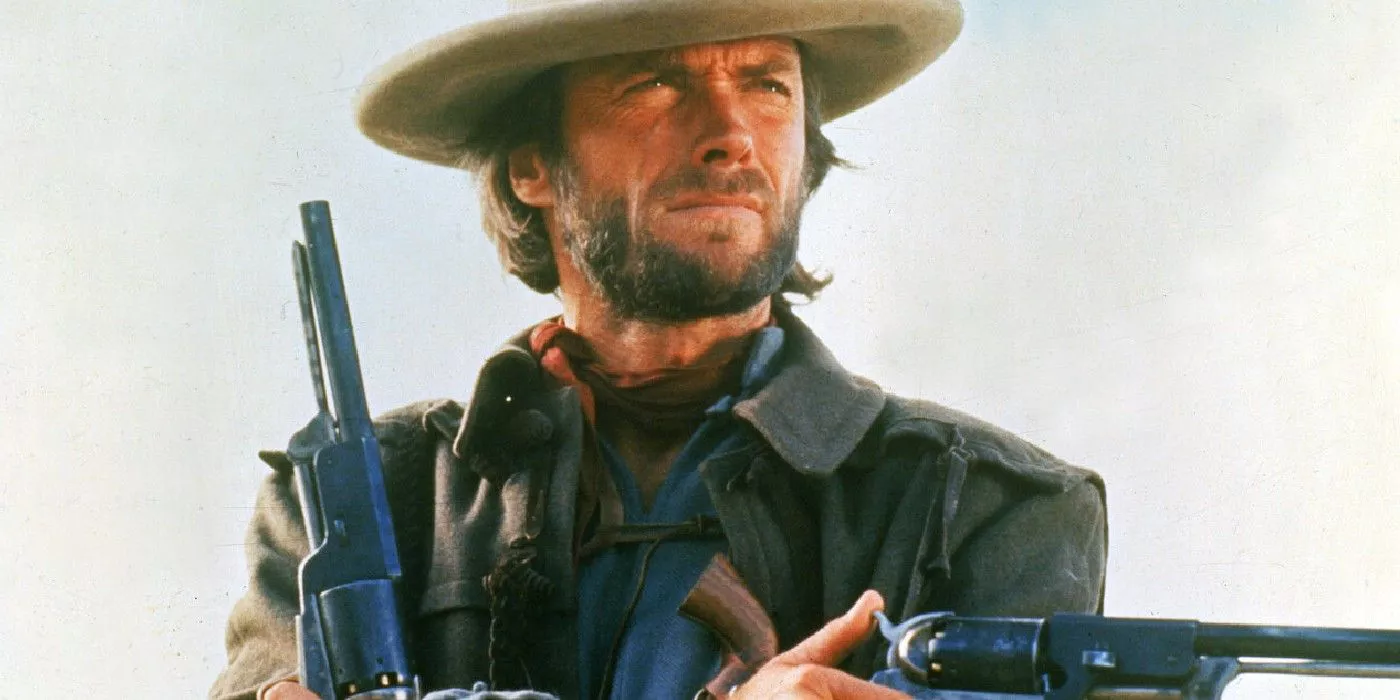 Clint Eastwood como Josey Wales empuñando sus armas en The Outlaw Josey Wales.