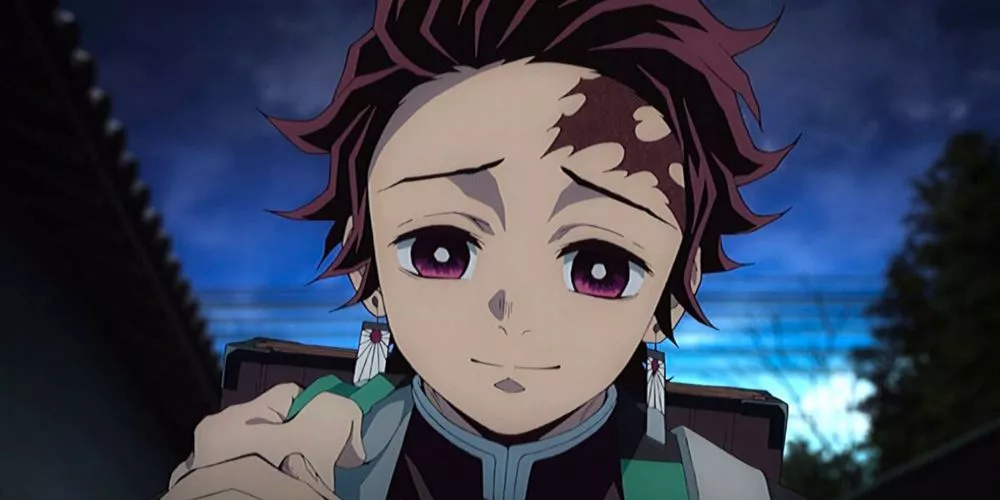 Tanjirou Kamado modestly smiles after battle in Demon Slayer: Kimetsu no Yaiba.