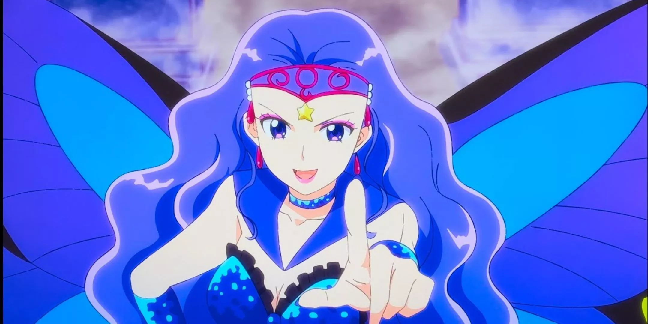 A smiling Sailor Heavy Metal Papillon stands with one hand on her hip and points with the other in Sailor Moon Cosmos