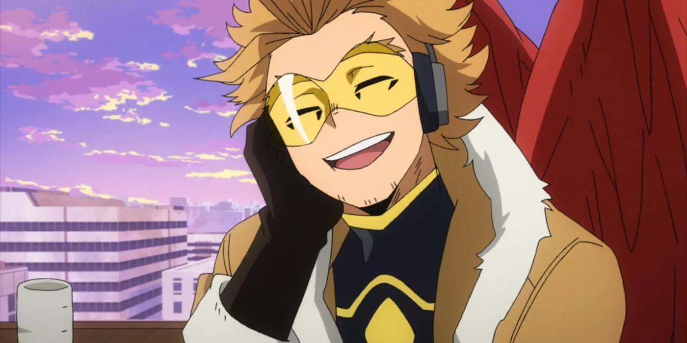 Hawks sonriendo con su mano en su mejilla derecha en My Hero Academia.