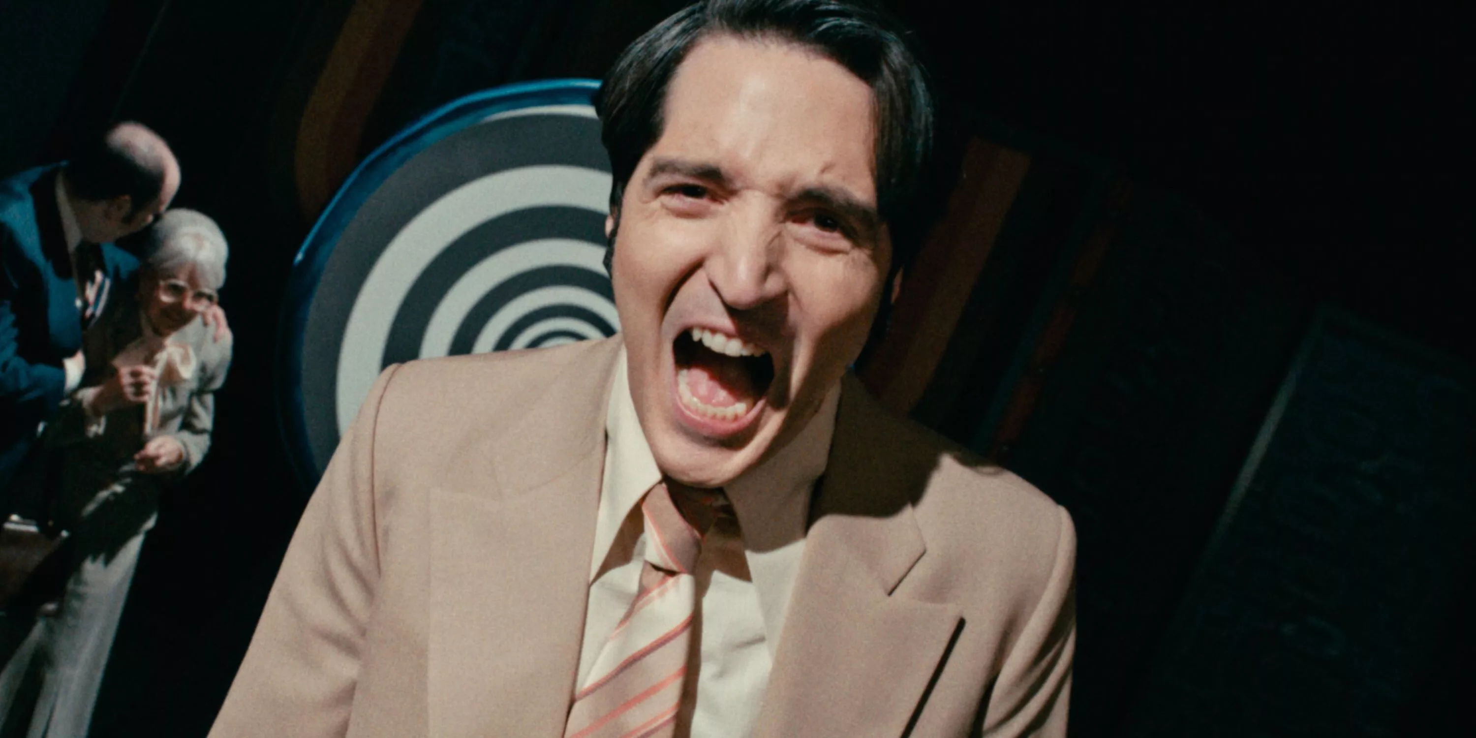 David Dastmalchian laughs as Jack Delroy, the television host featured in Late Night with the Devil.