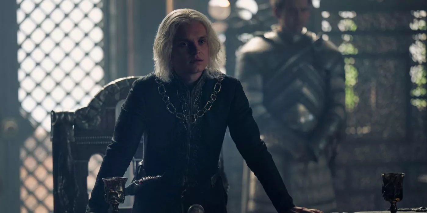 Aegon II Targaryen (actor Tom Glynn-Carney) stands in the small council room in House of the Dragon