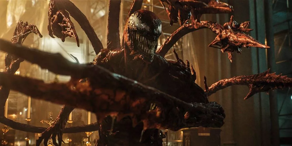 Carnage forms weapons as he appears in Venom: Let There Be Carnage movie.