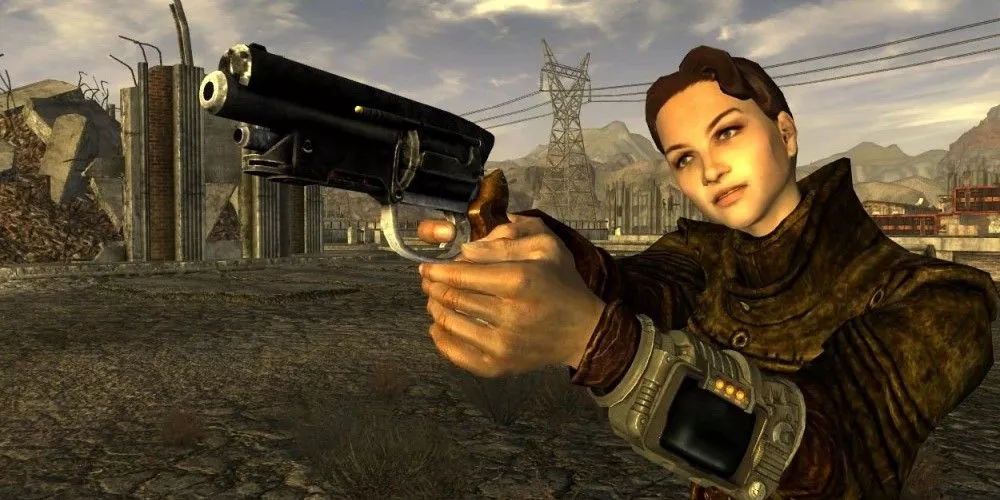 5.56mm Pistol from Fallout: New Vegas held by the courier.