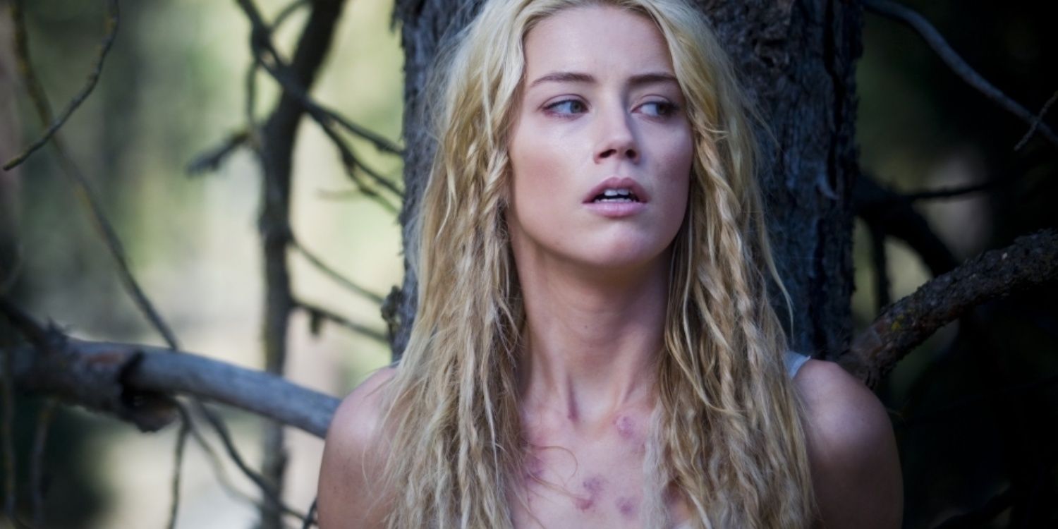 Amber Heard in front of a tree in The Ward