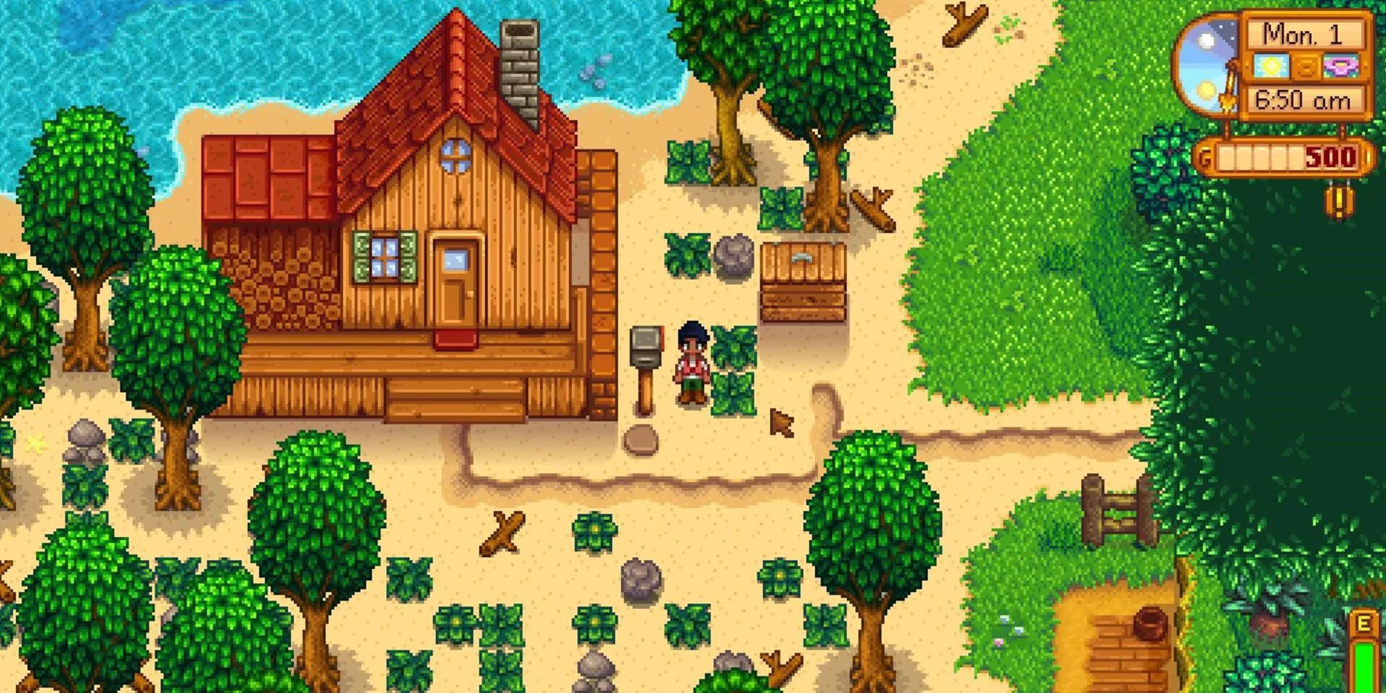 Una captura de pantalla de la granja de playa de Stardew Valley, que incluye una cabaña y varios árboles