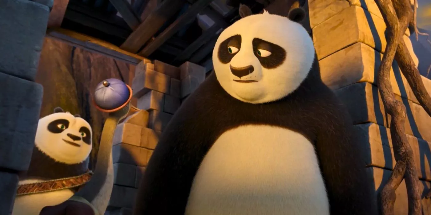 Po looks sadly at his dads in Kung Fu Panda 4