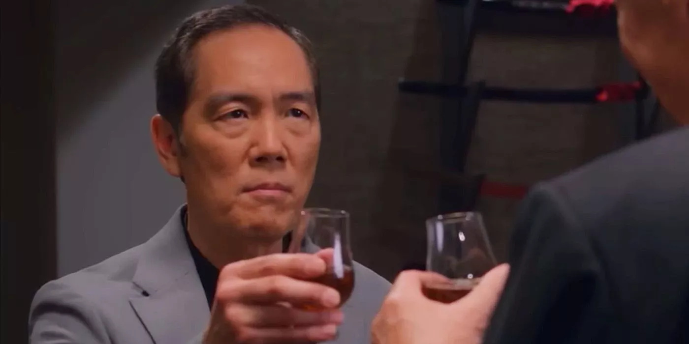 Chozen and Terry Silver make a toast in Cobra Kai.