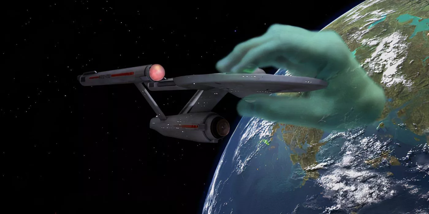 A green hand grabs the Enterprise in Star Trek Who Mourns for Adonis