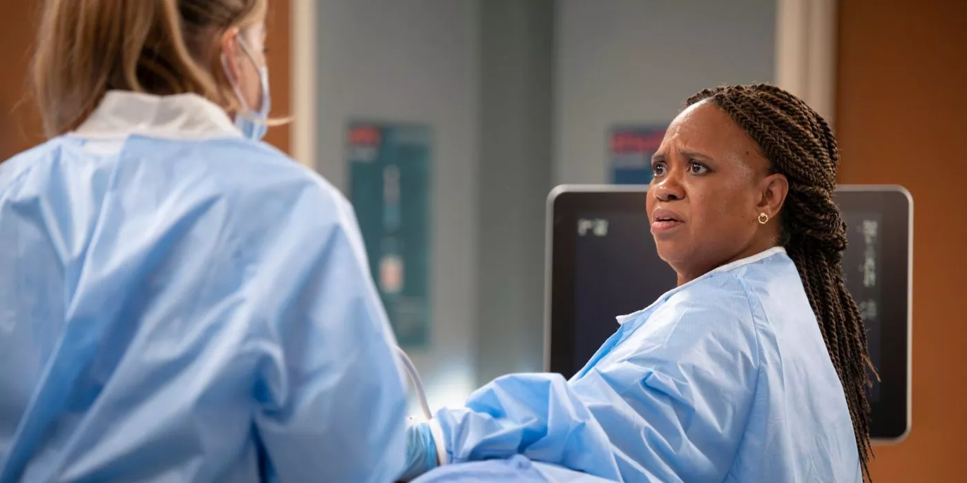 Bailey looks at Meredith, surprised, while both wear light blue surgical gowns on Grey's Anatomy