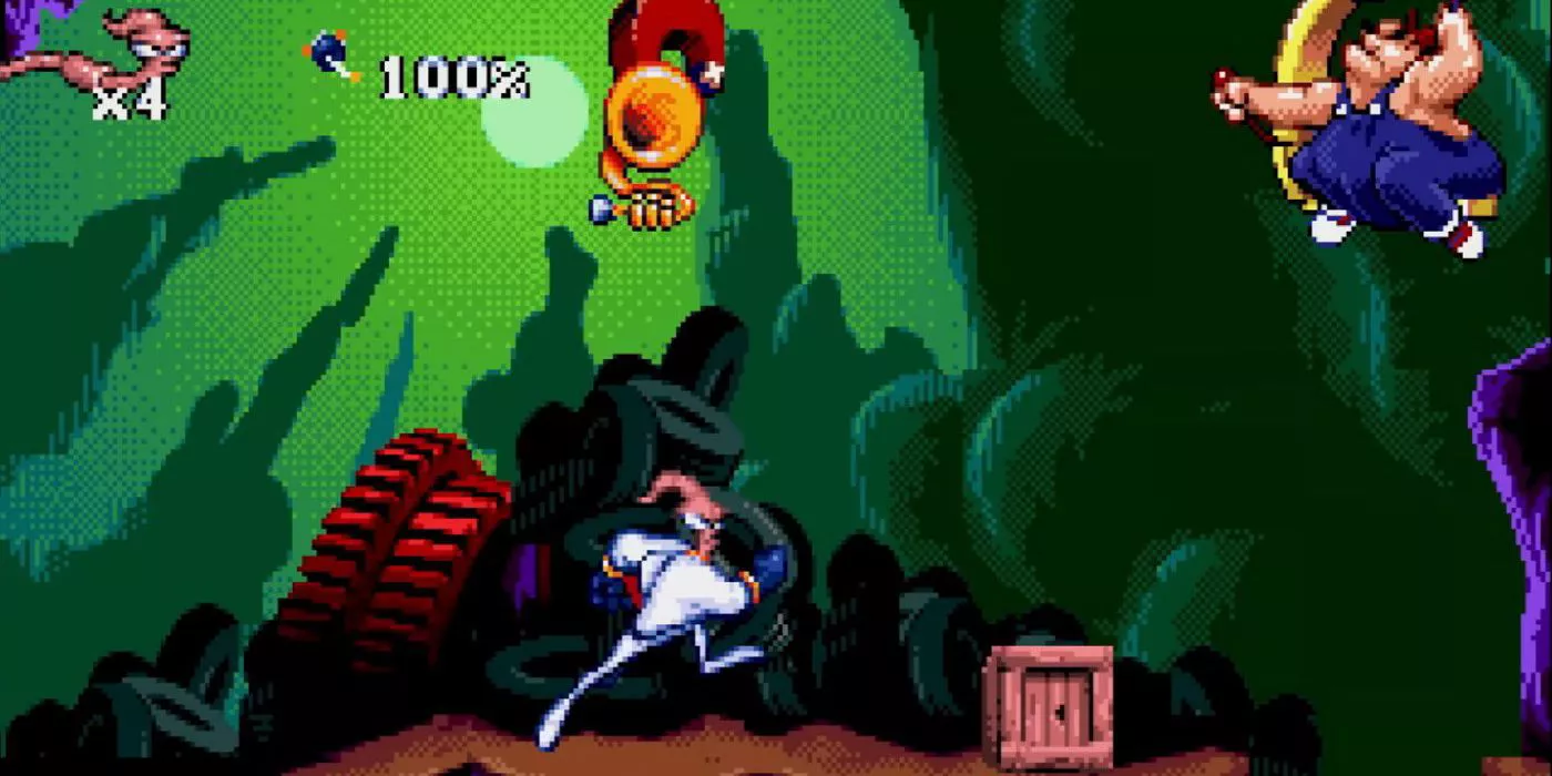 Jim runs toward a man perched on a construction machine in Earthworm Jim.