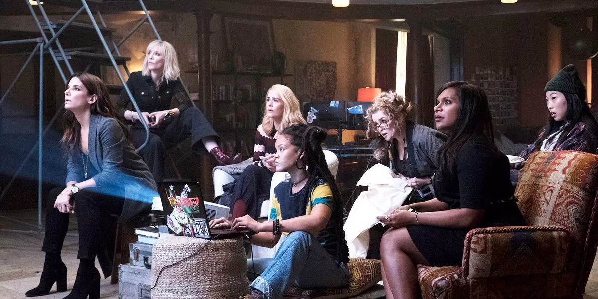 The cast of Ocean's Eight sitting and watching something