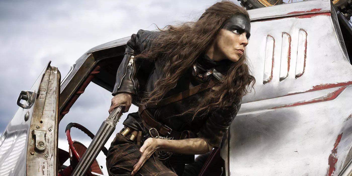 Anya Taylor-Joy as Furiosa jumping out of a vehicle to help her convoy moments after being ambushed by Dementus and his men in Furiosa: A Mad Max Saga.