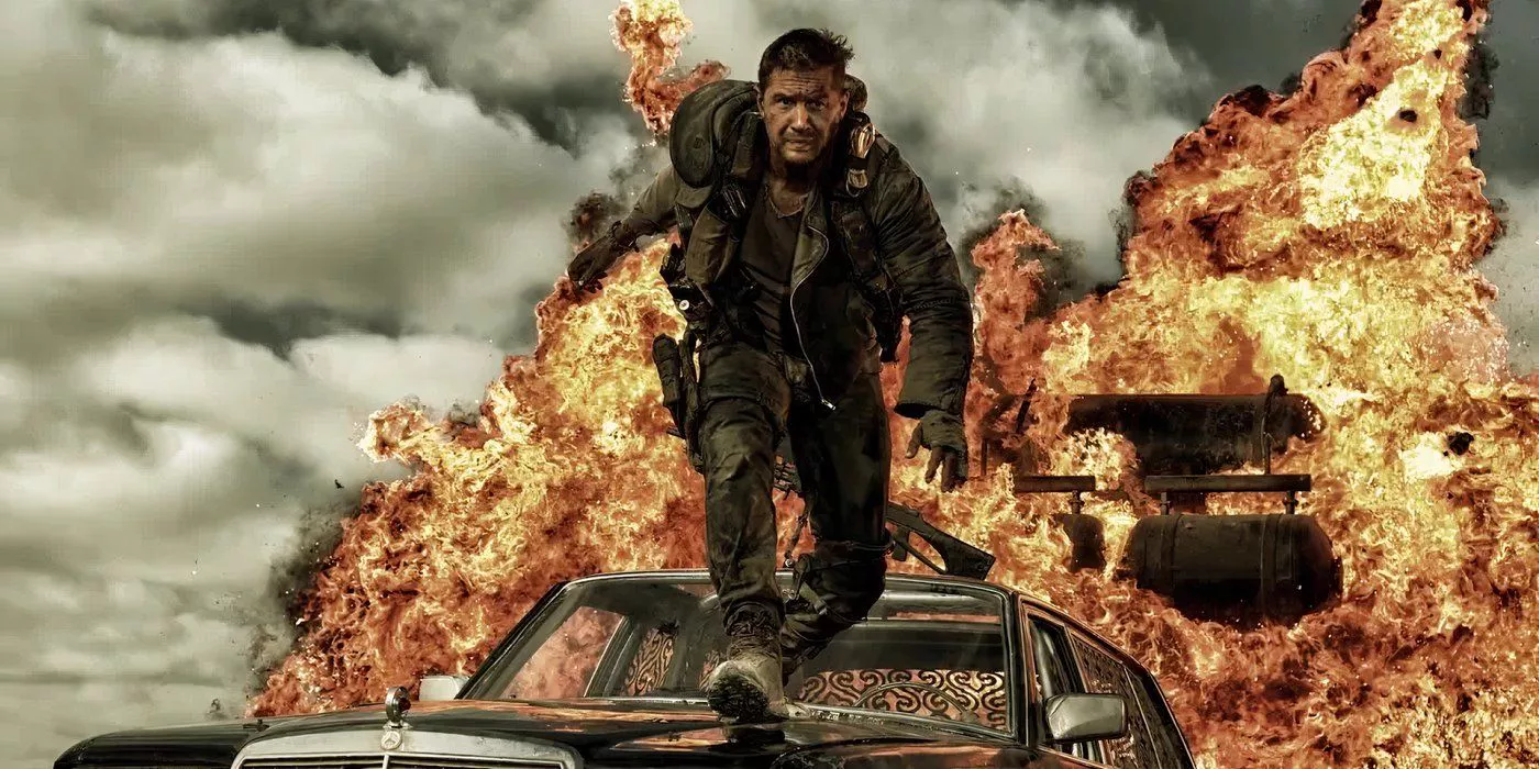 Tom Hardy as Mad Max jumping from vehicle to vehicle when one explodes behind him in Mad Max: Fury Road.