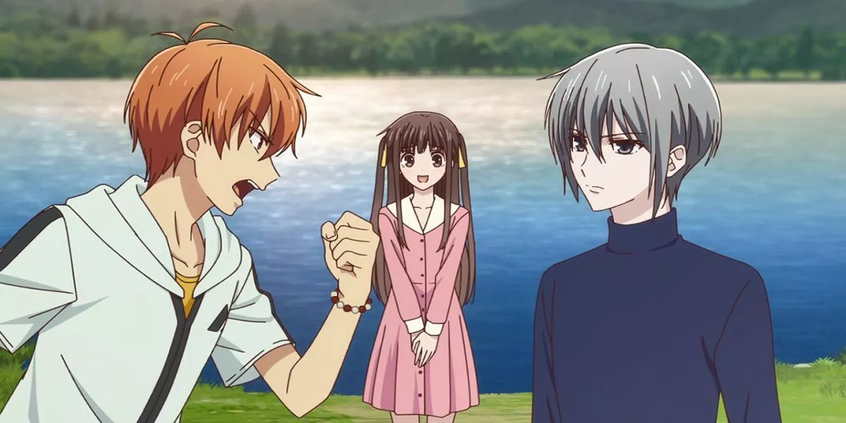 Tohru from Fruits Basket standing in the background while Kyo yells at Yuki.