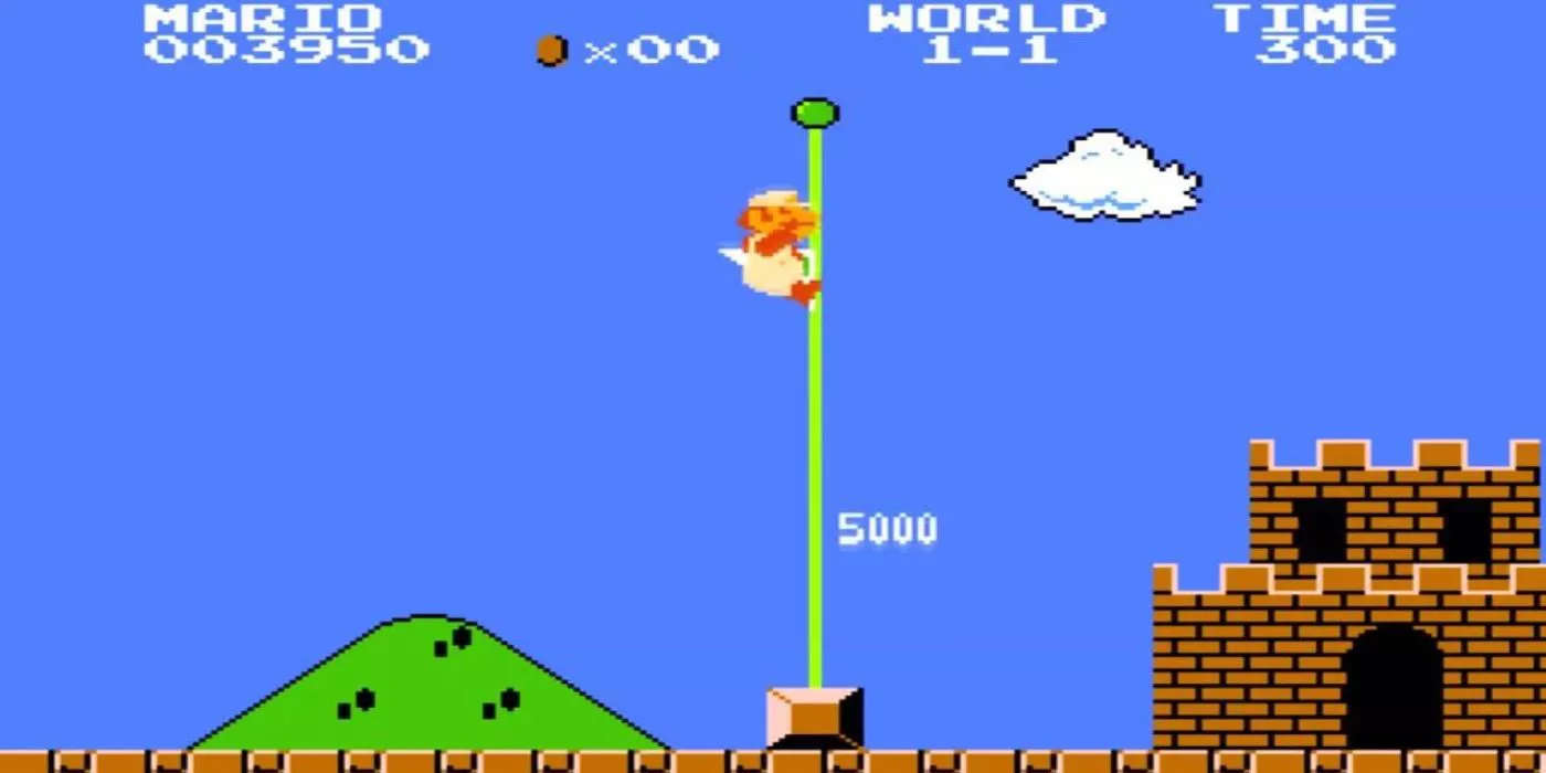 Super Mario Bros en NES con Mario deslizándose por el poste de la bandera