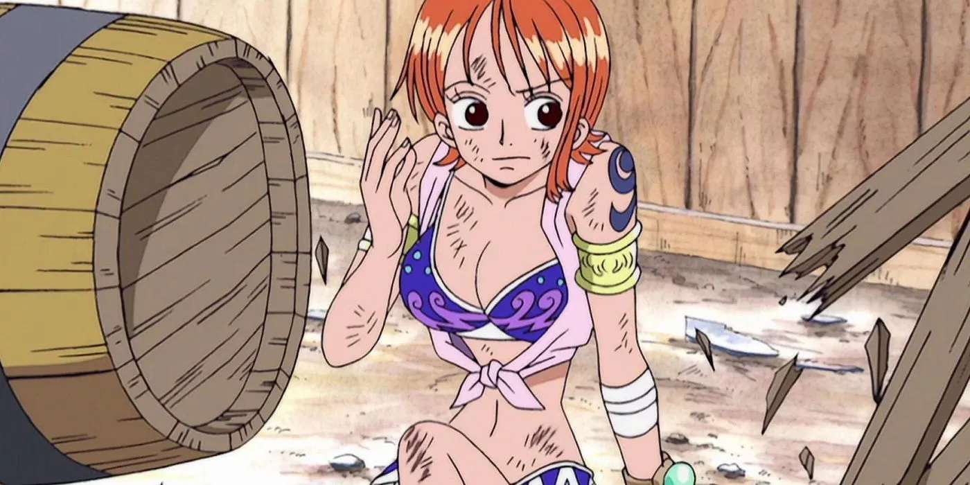 Nami sits on the street amid debris during the Alabasta Arc in One Piece.