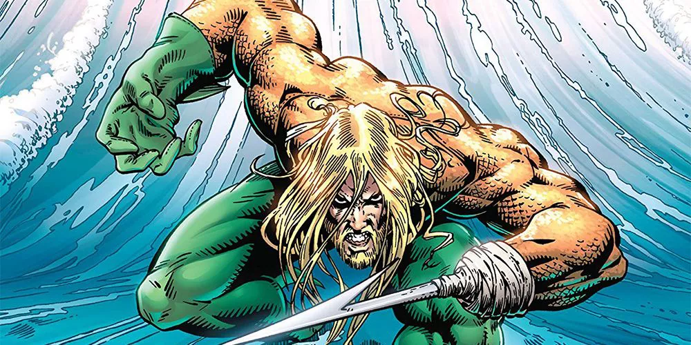 Aquaman with his hook hand in front of a wave in DC Comics.