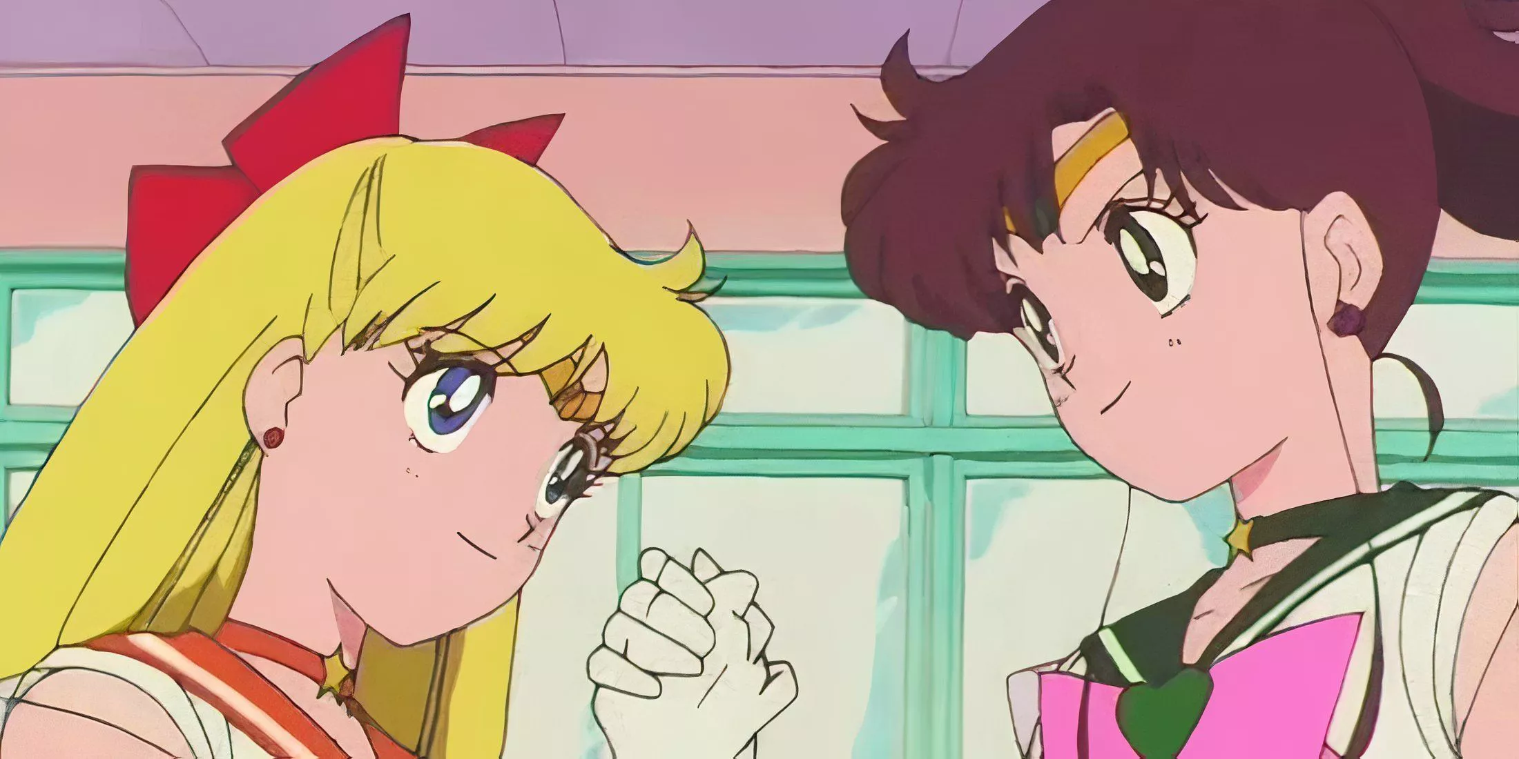 Jupiter and Venus shake hands in Clash of Dreams Minako and Makoto's Broken Friendship