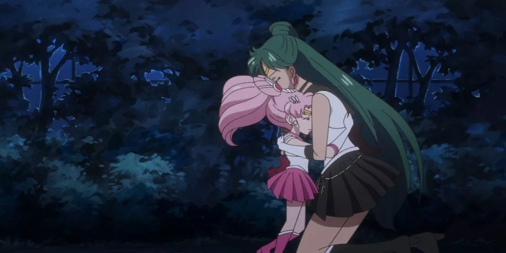 Sailor Pluto hugs Sailor Mini Moon from Sailor Moon Crystal.