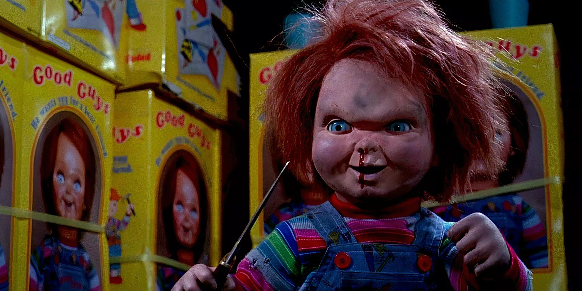 Chucky is holding a knife by Good Guy dolls in Child's Play 2