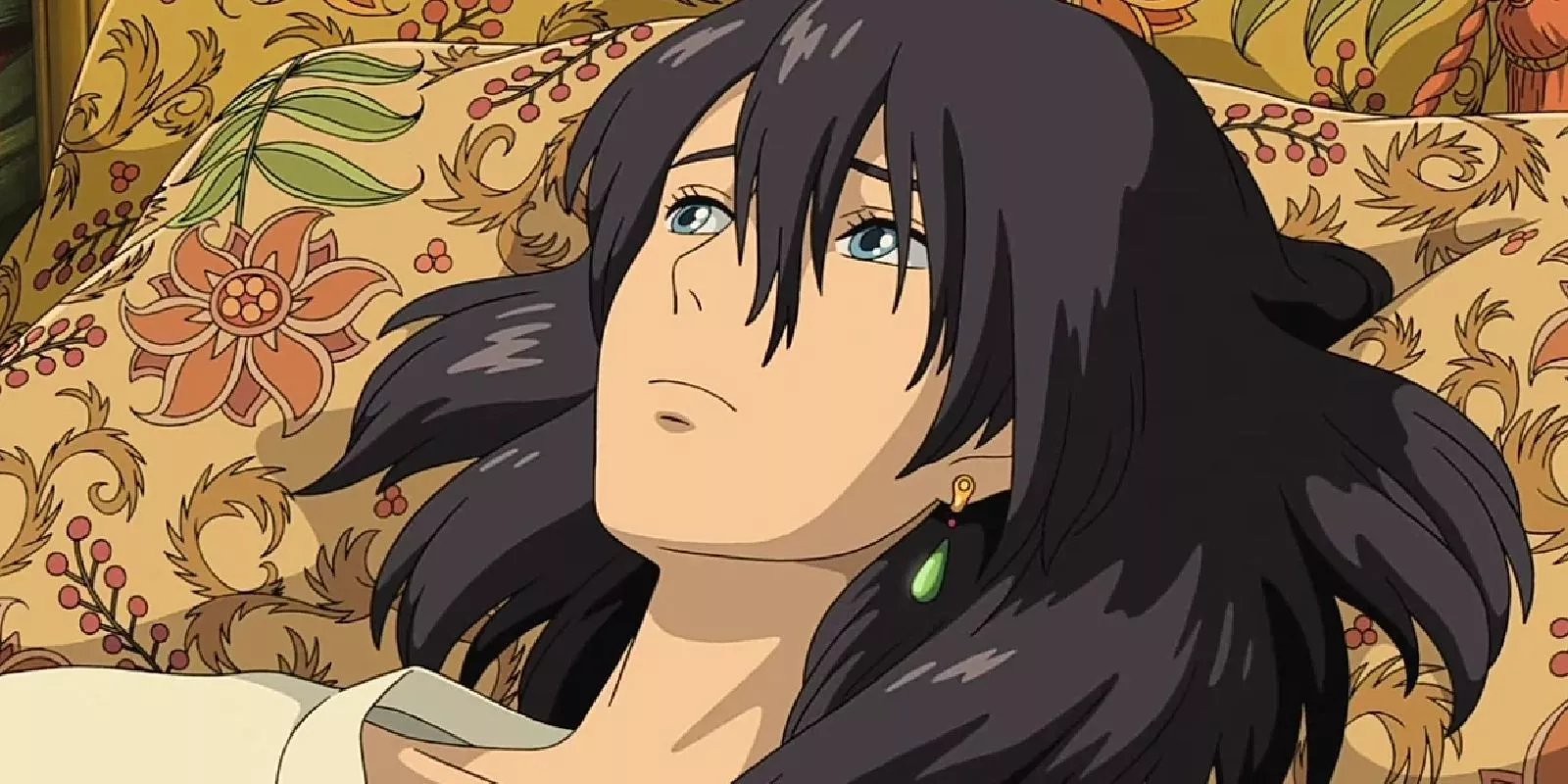 Howl Pendragon is moping and laying on his bed in Howl’s Moving Castle 