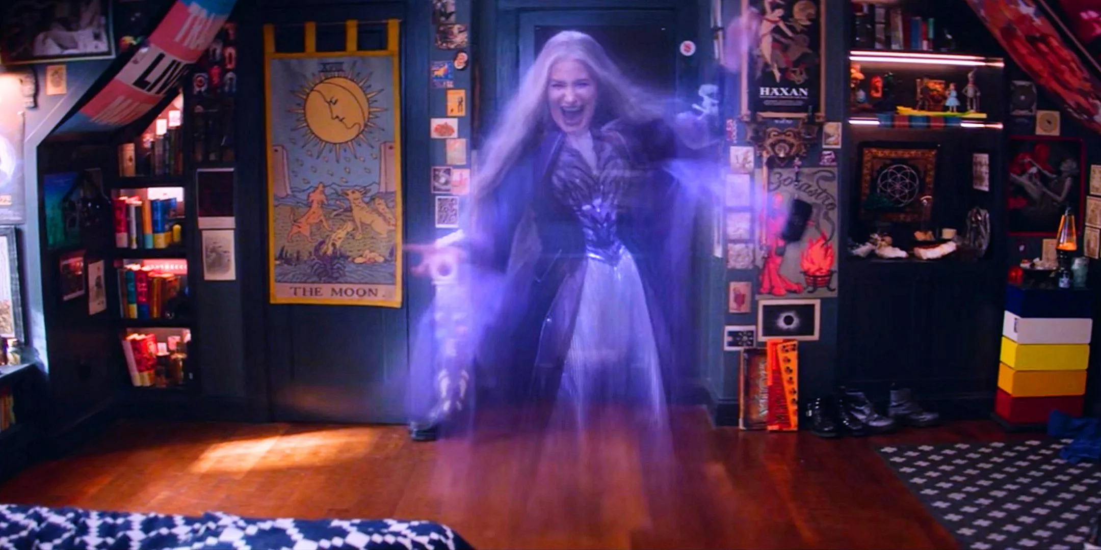 Kathryn Hahn as a ghost Agatha Harkness smiling and laughing in William Kaplan's room from Agatha All Along