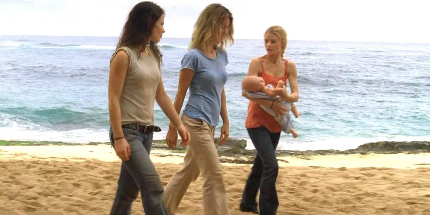 Claire sostiene al bebé Aaron mientras camina por la playa con Kate y Libby en Lost