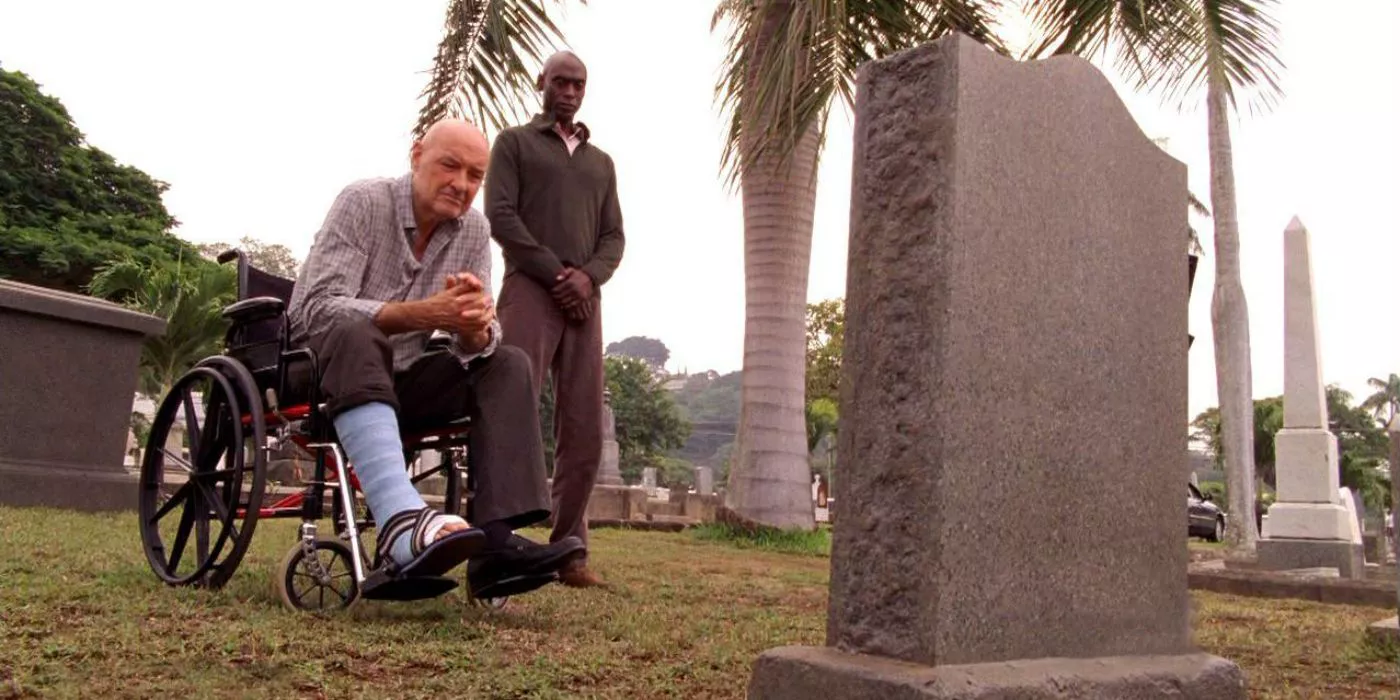 John Locke y Matthew Abaddon miran una tumba en Lost