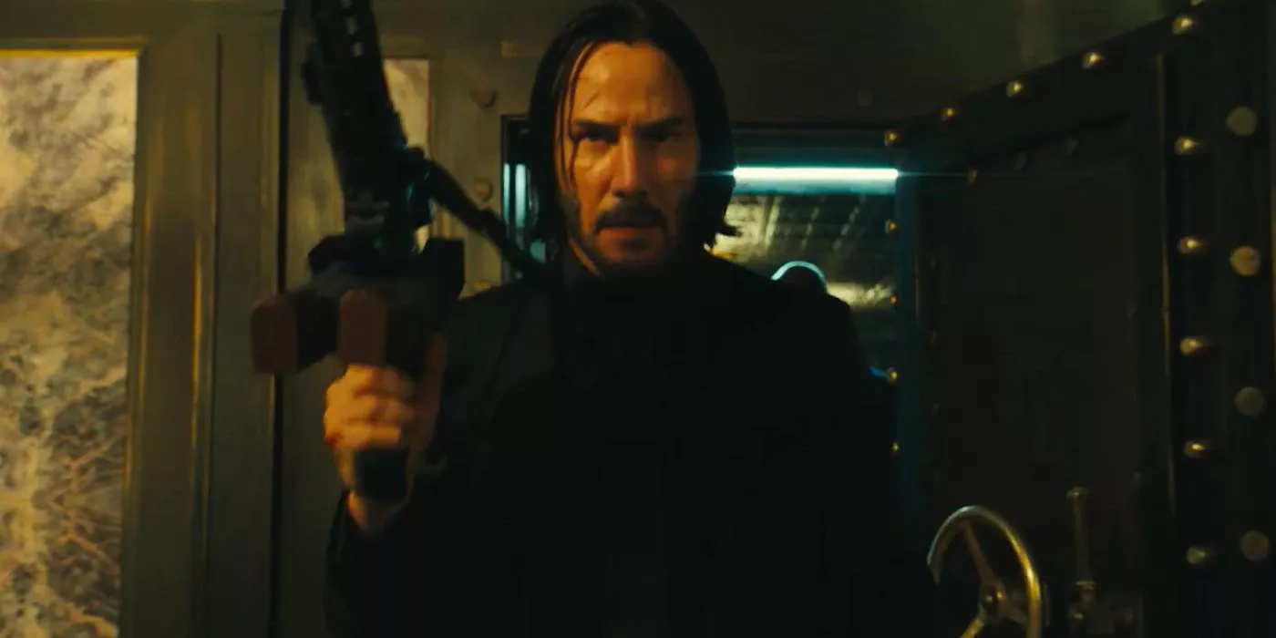 John Wick walks out with a rifle in John Wick 3 Parabellum