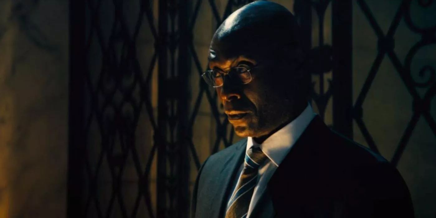 Lance Reddick is at his desk as Charon in John Wick: Chapter 4.