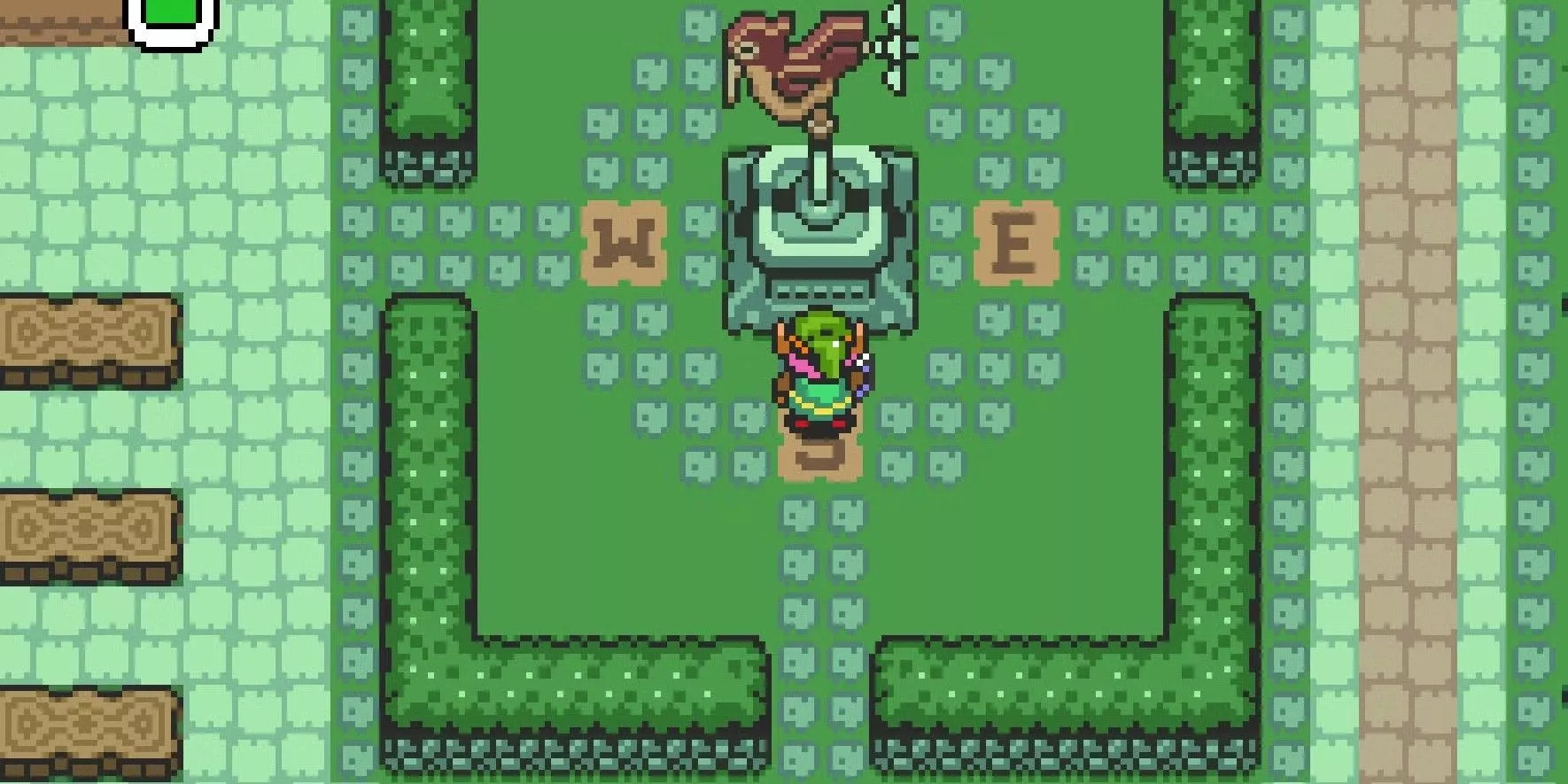 Link de pie cerca de una brújula en el suelo en Kakariko Village en A Link to the Past