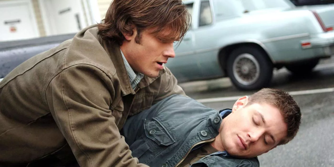 Supernatural's Sam Winchester (Jared Padalecki) is holding his brother Dean (Jensen Ackles) in Season 3, Episode 11, 'Mystery Spot.'