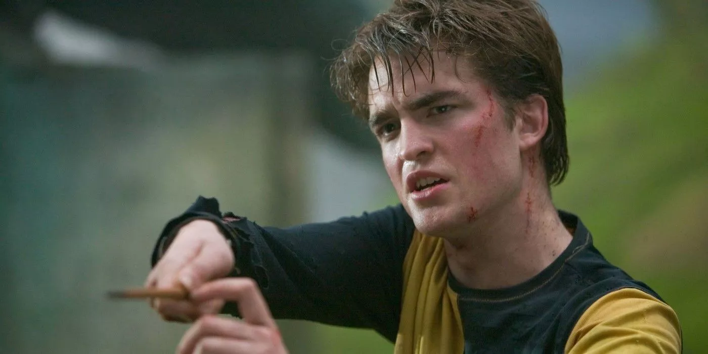 Cedric Diggory (actor Robert Pattinson) holds up a wand in Harry Potter and the Goblet of Fire