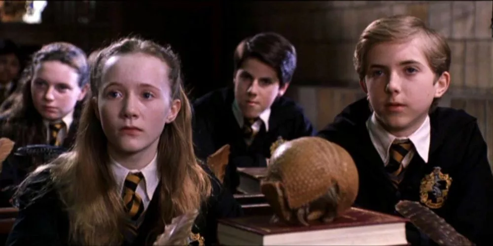 Hannah Abbott with classmates looking worried in Harry Potter and the Chamber of Secrets