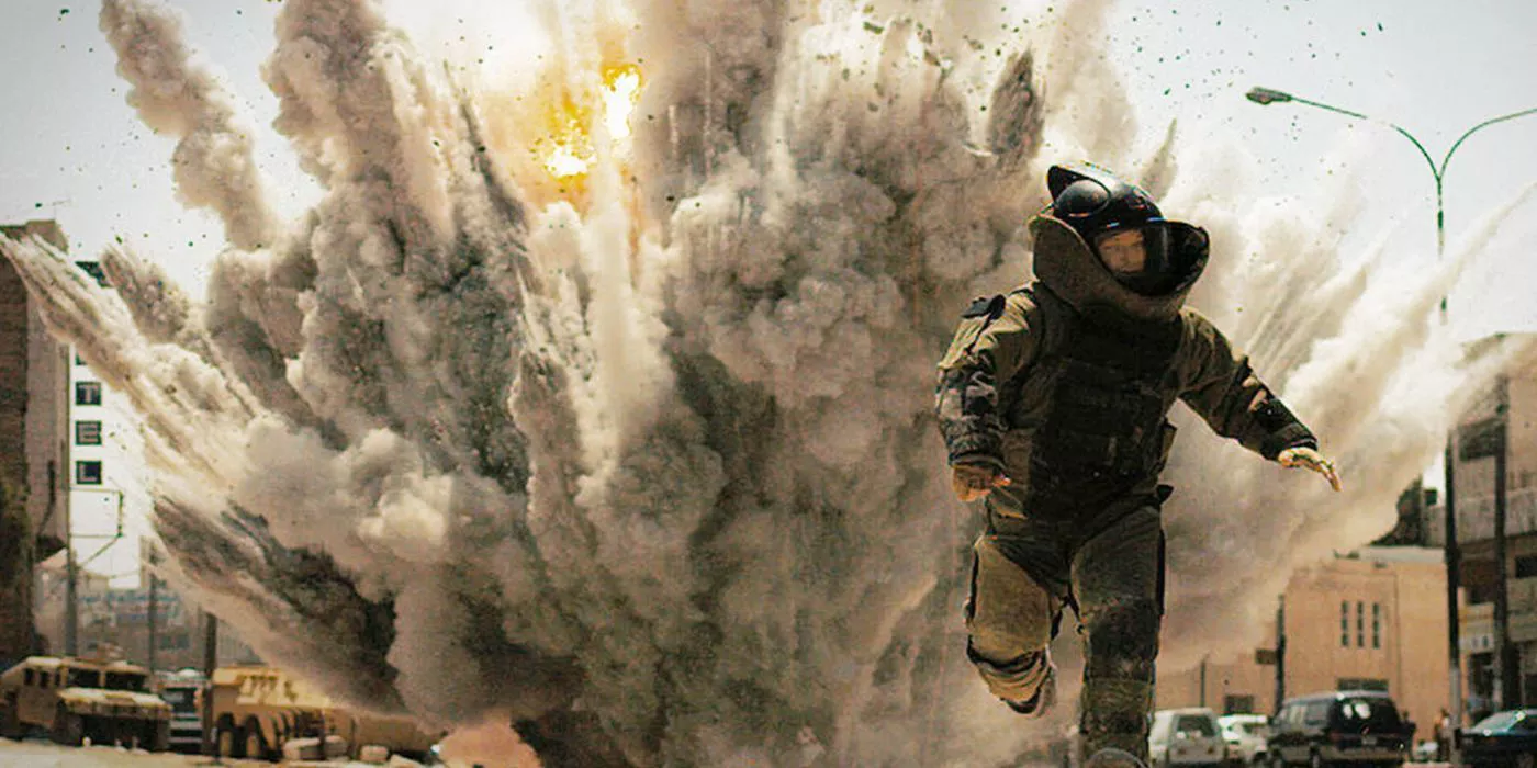 A soldier wearing a bomb suit flees a huge explosion in The Hurt Locker