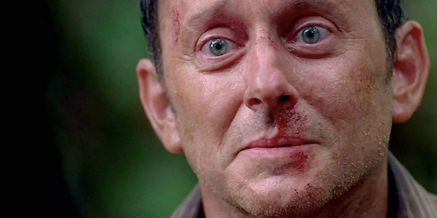 Benjamin Linus with a bloody nose and looking sad on Lost