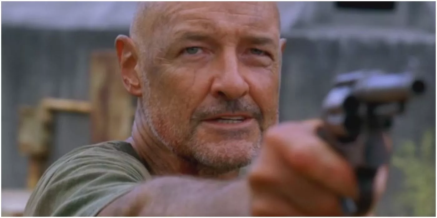 John Locke holding a gun and threatening someone on Lost