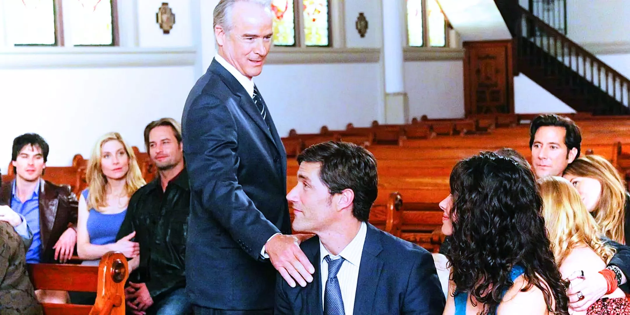 The characters of Lost assembled in a church as Christian shepherd touches Jack on the shoulder from the Lost Series Finale